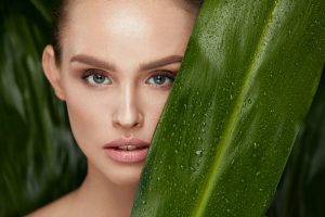 Beauty,Woman,Face,With,Healthy,Skin,And,Green,Plant